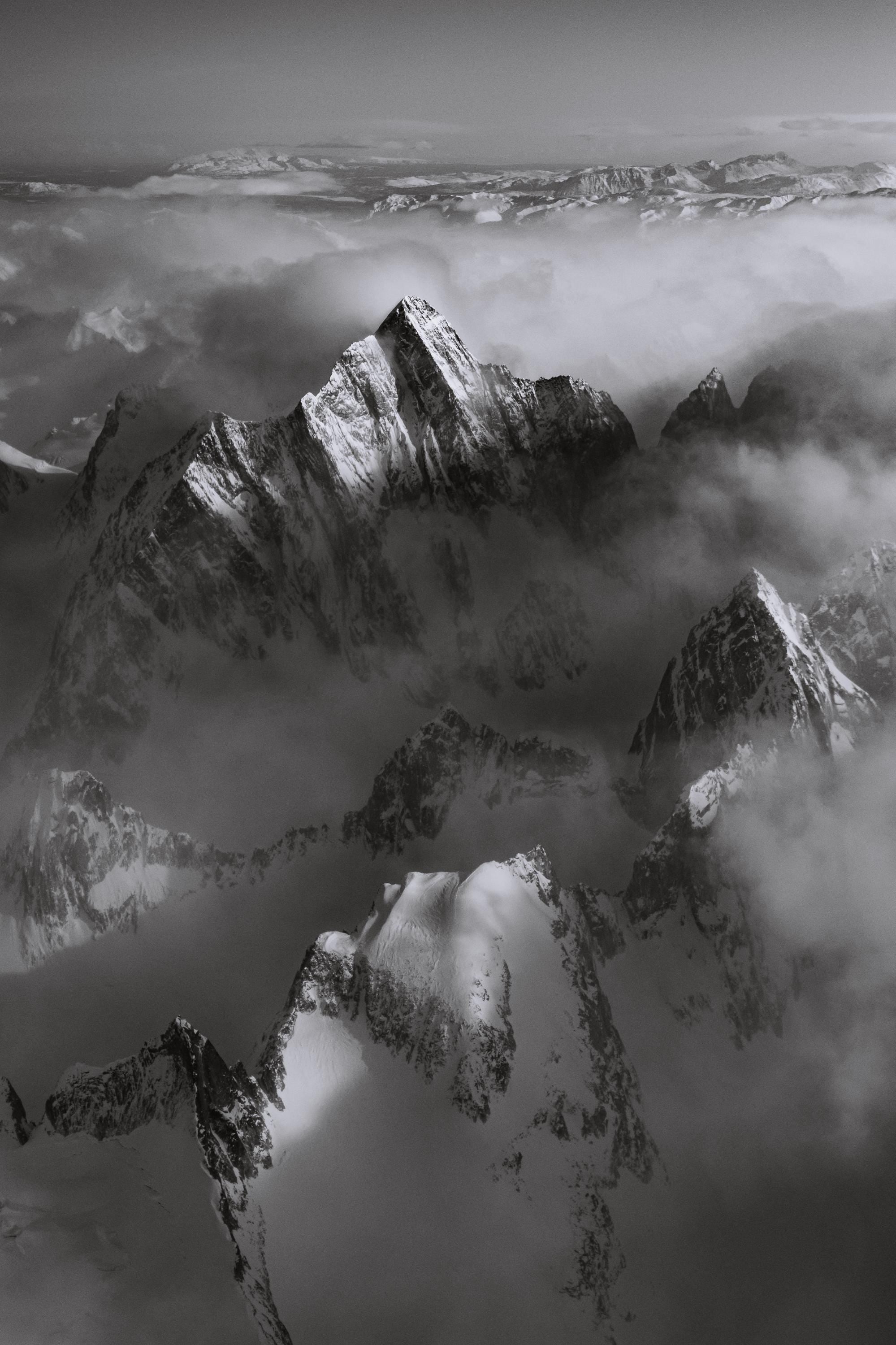 a black and white photo of a mountain range