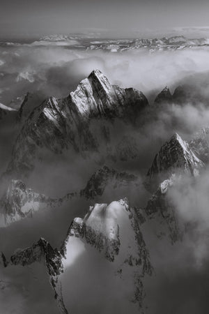 a black and white photo of a mountain range