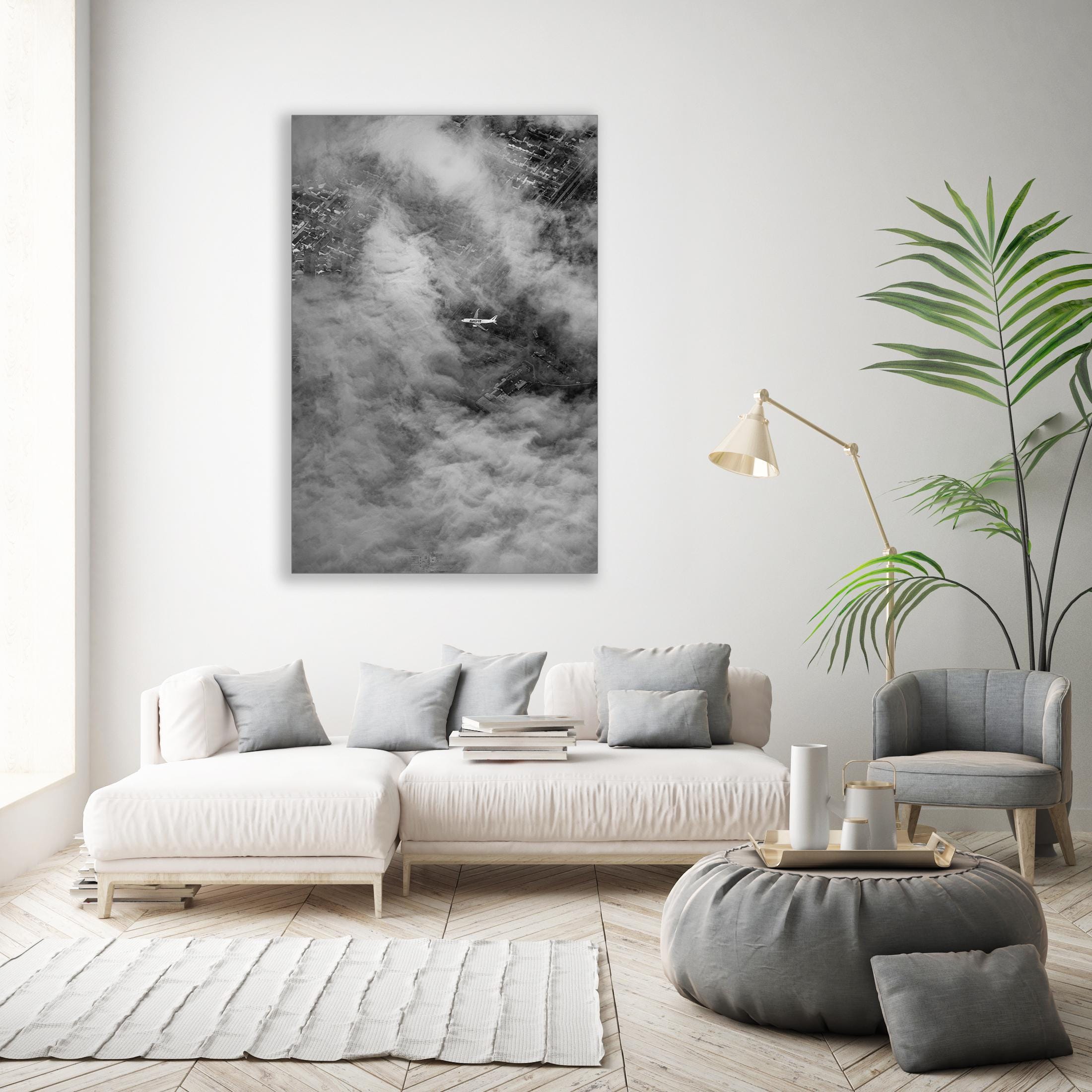 a living room with a white couch and a white rug