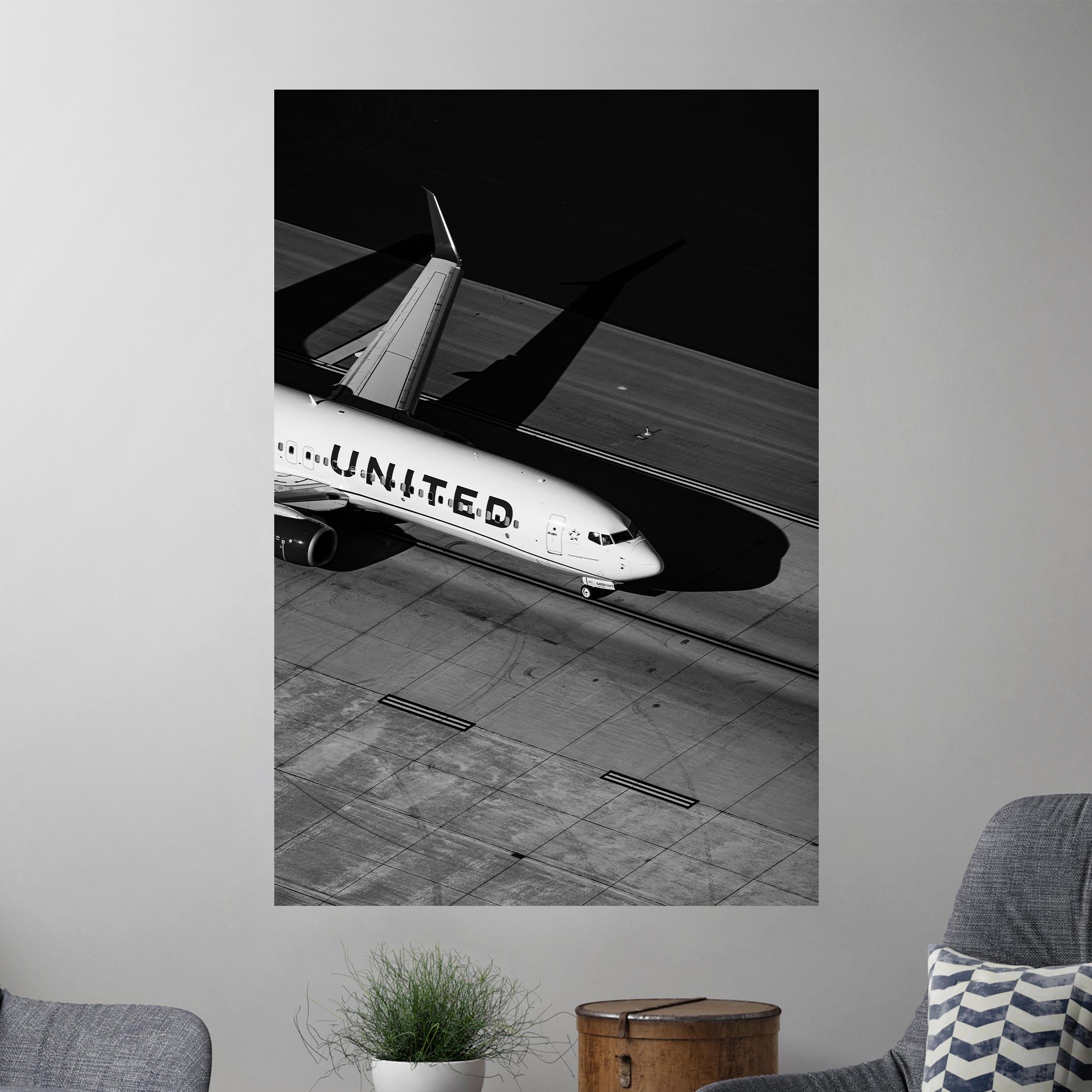 a black and white photo of a united airplane