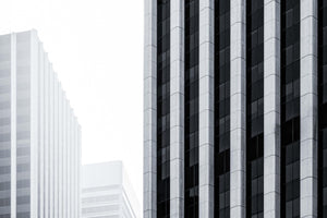 a black and white photo of tall buildings