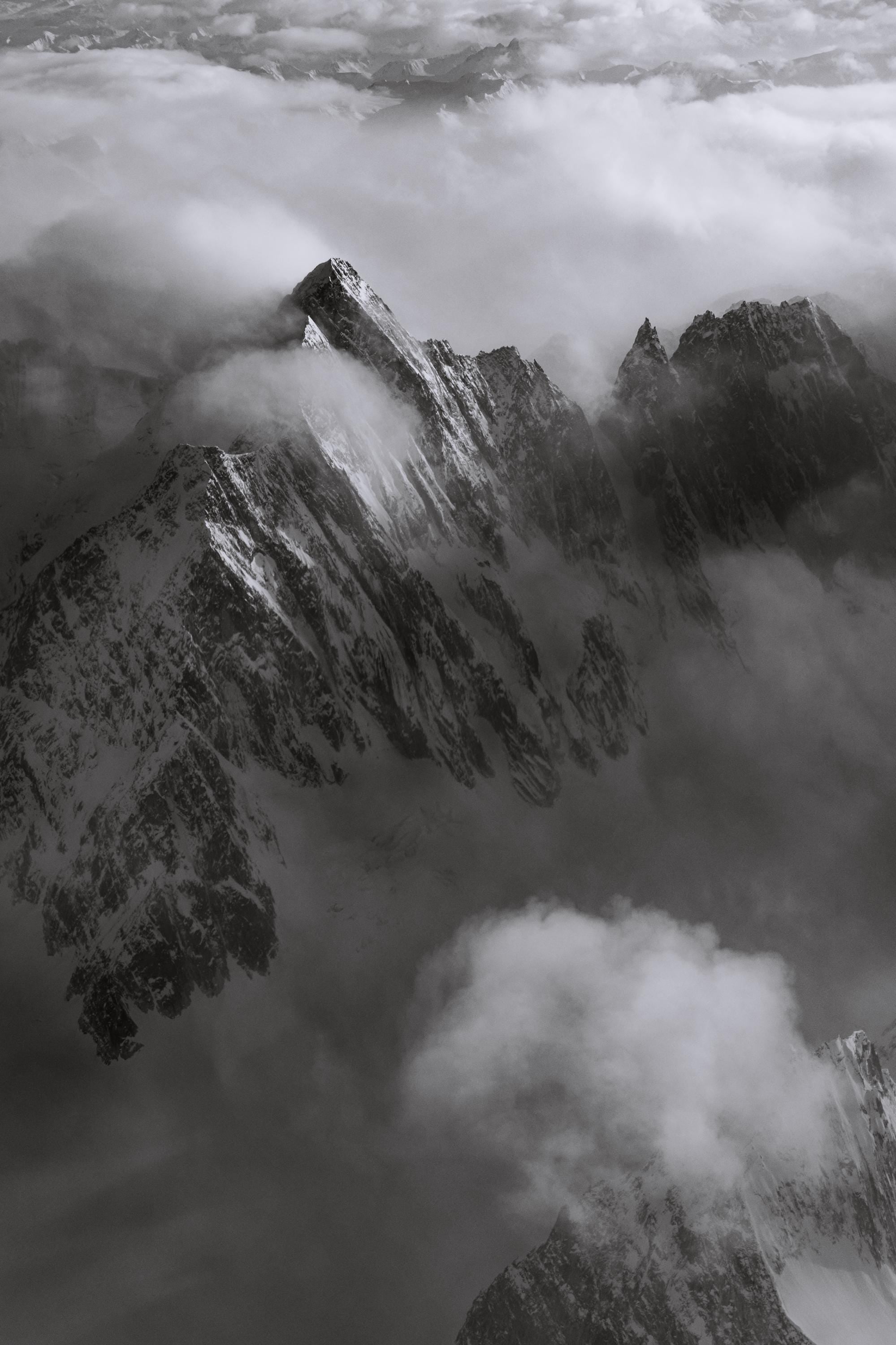 a black and white photo of the top of a mountain