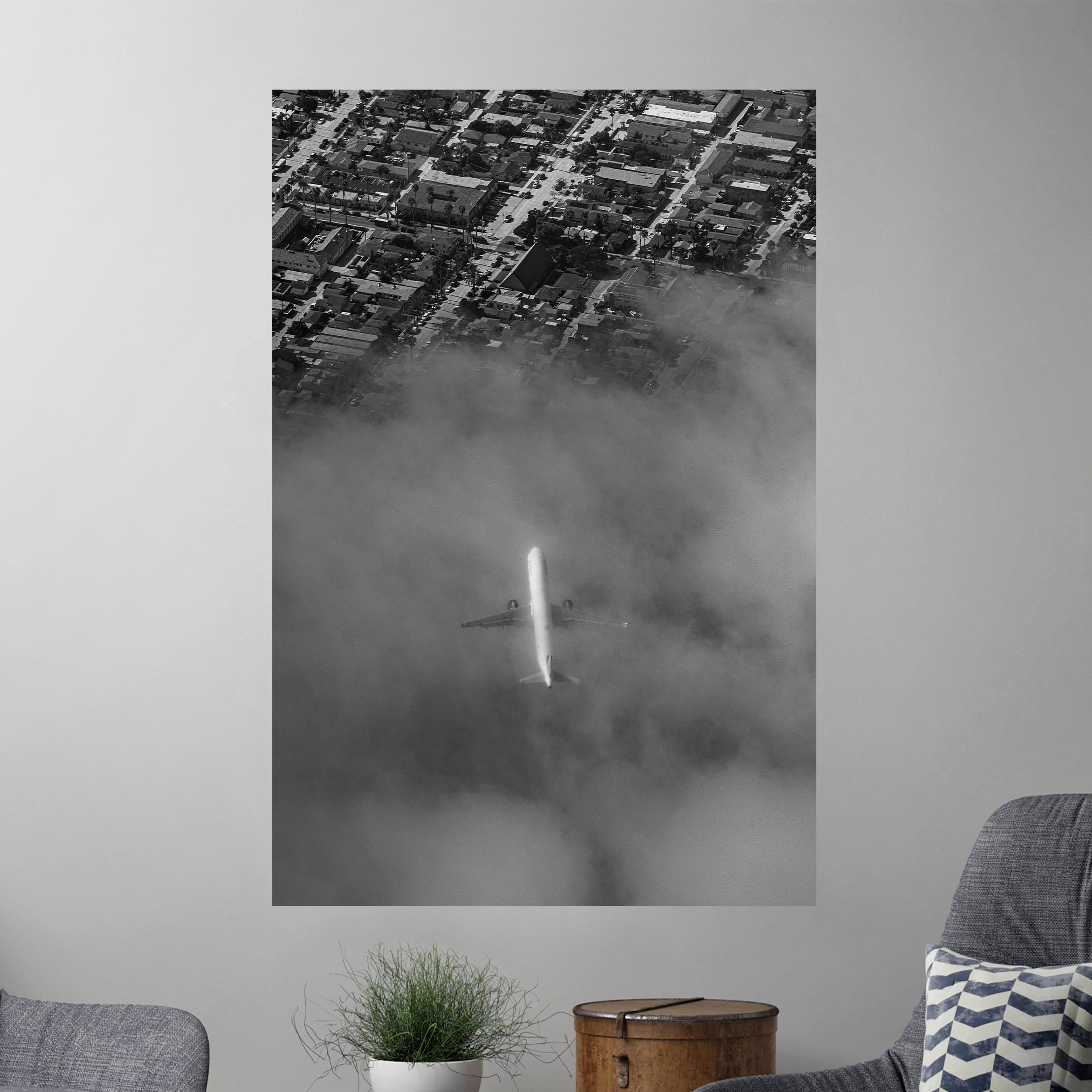 a black and white photo of a city in the fog