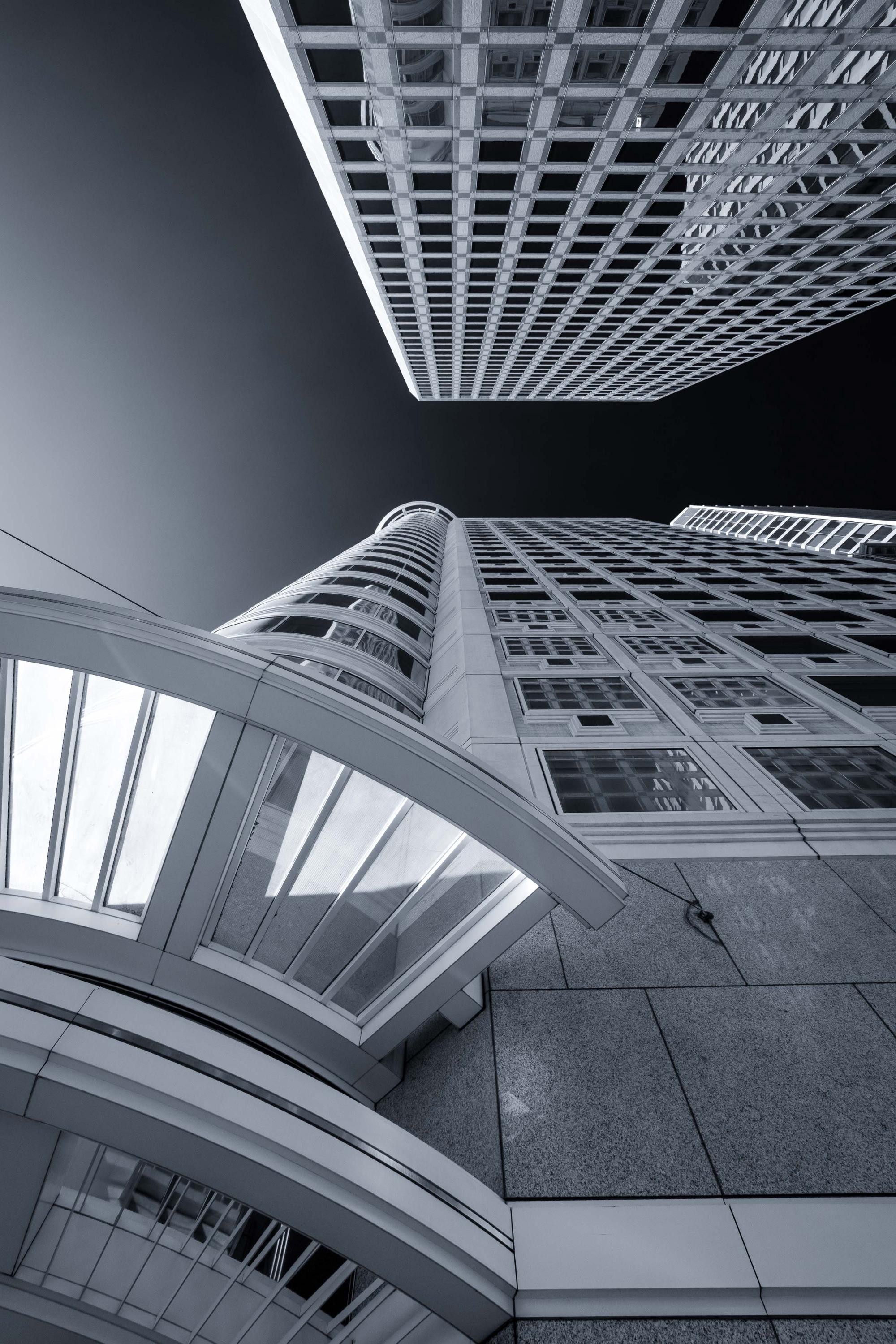 a black and white photo of tall buildings