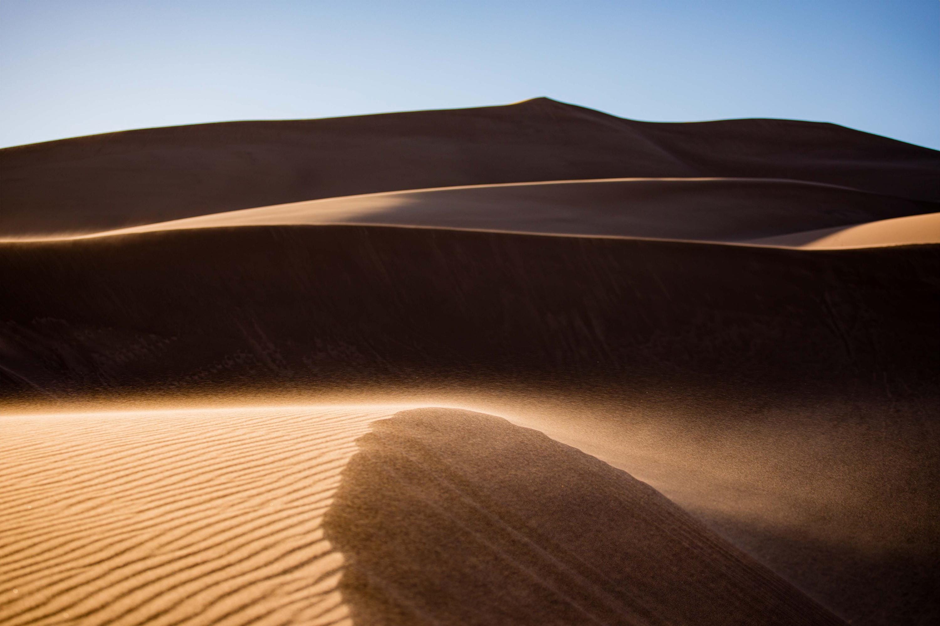 a sand dune in the middle of a desert