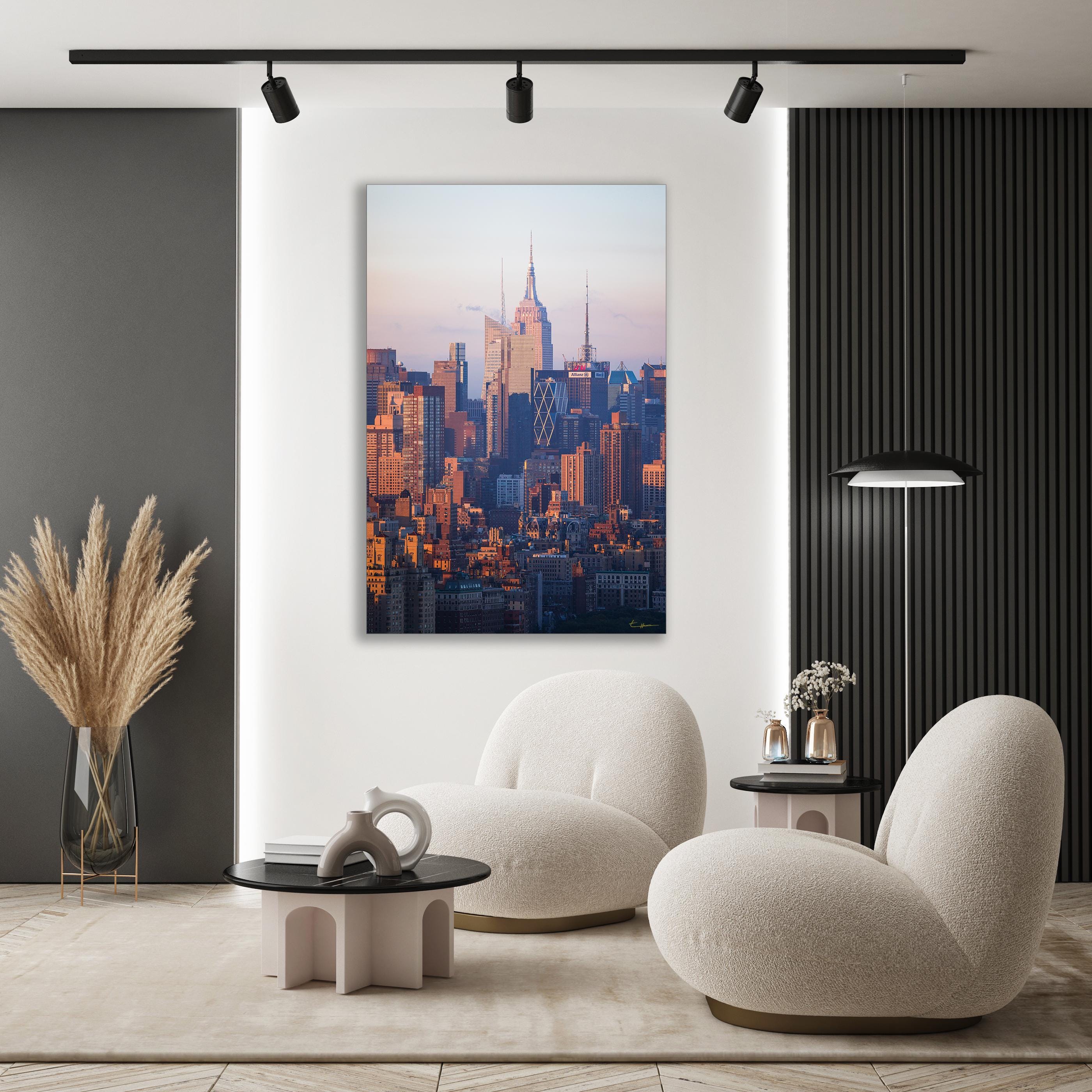 a living room with a painting of a city skyline