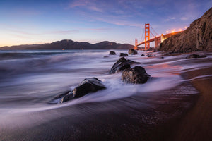 a view of the golden gate bridge from the beach